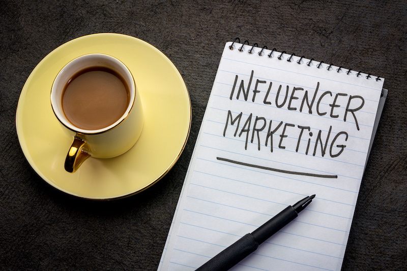 influencer marketing  -  handwriting in a spiral notebook